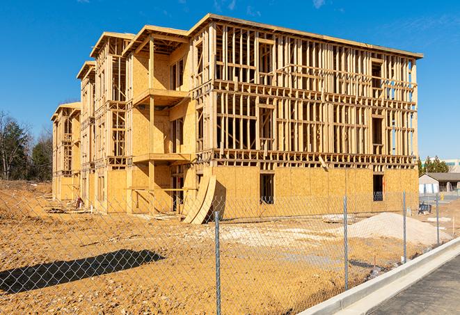 a close-up of temporary chain link fences enclosing a construction site, signaling progress in the project's development in Inkerman